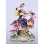 19TH C. DERBY FIGURE OF THE WELSH TAILOR'S WIFE SEATED ON A GOAT. 14cm high and 10cm wide.