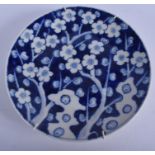 AN EARLY 20TH CENTURY JAPANESE BLUE ND WHITE PORCELAIN DISH, decorated with prunus in the chinese ta