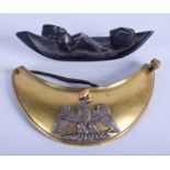 A VINTAGE CONTINENTAL MILITARY GORGET together with a carved boat. 16 cm & 12 cm wide. (2)