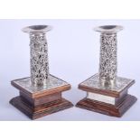 A PAIR OF 19TH CENTURY CHINESE EXPORT SILVER CANDLESTICKS by Wang Hing. 18 oz overall. Silver 9 cm h