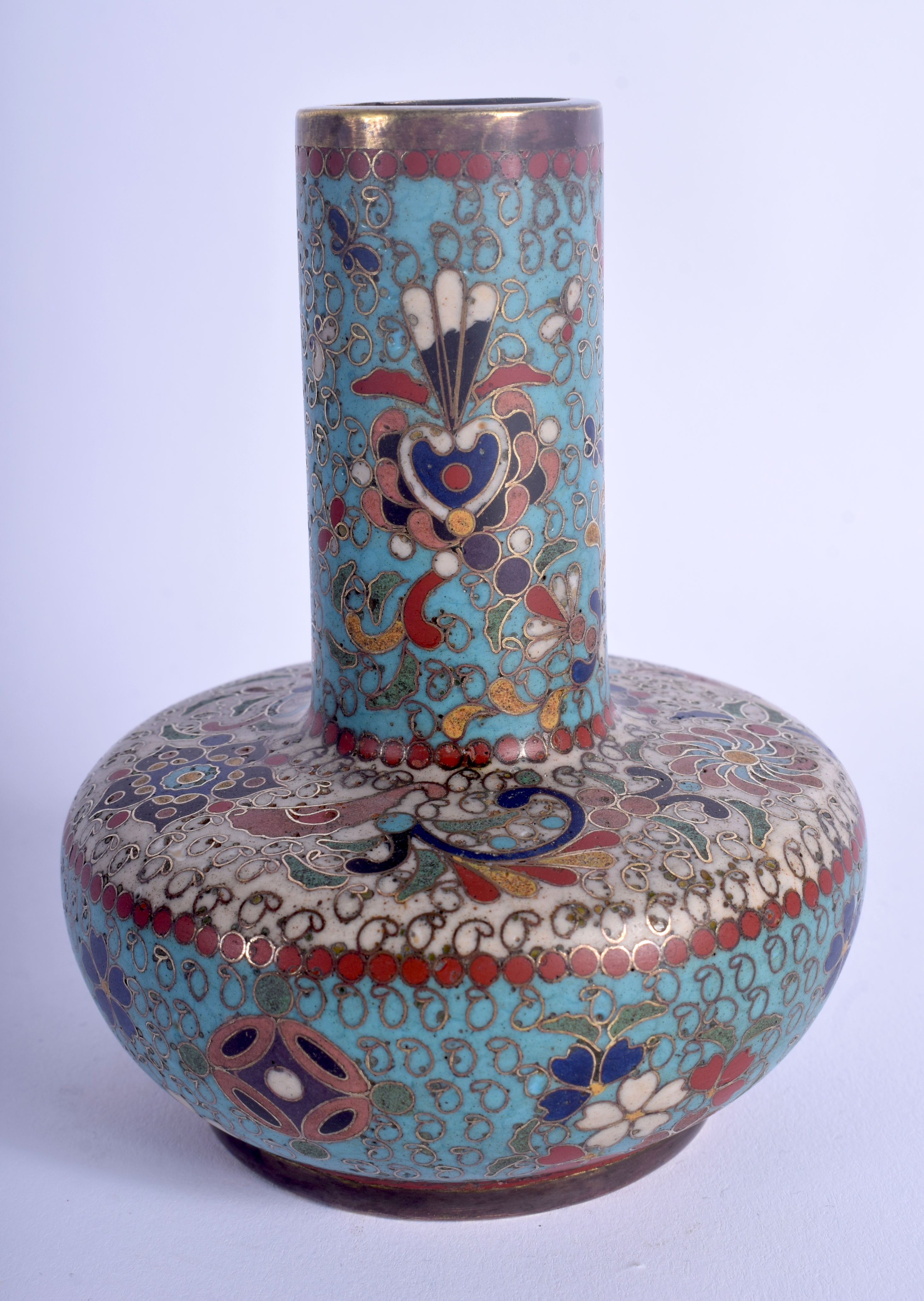 A 19TH CENTURY JAPANESE MEIJI PERIOD CLOISONNE ENAMEL VASE decorated with swirling foliage. 10.5 cm
