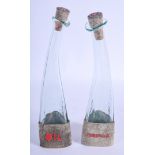 A PAIR OF VINTAGE OIL AND VINEGAR BOTTLES. 25 cm high.