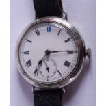AN ANTIQUE SILVER TRENCH STYLE WRISTWATCH. 3.75 cm wide.