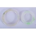 TWO CHINESE JADEITE BANGLES. Largest 6.75 cm wide. (2)