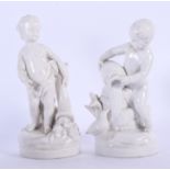 A PAIR OF WHITE GLAZED NAPLES PORCELAIN FIGURINES. 19 cm high.