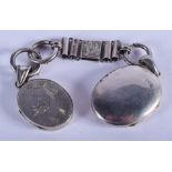 A VICTORIAN AESTHETIC MOVEMENT SILVER LOCKET on chain. 11 cm wide.