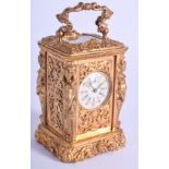 A CONTINENTAL MINIATURE CARRIAGE CLOCK. 8 cm high inc handle.