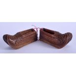 A PAIR OF ANTIQUE CONTINENTAL CARVED WOOD CLOGS. 8 cm wide.