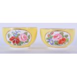 DERBY PAIR OF YELLOW GROUND TEABOWL PAINTED WITH FLOWERS. 4.5cm high and 7.5cm wide