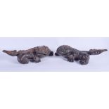 A PAIR OF CHINESE CARVED WOOD BEASTS. 30 cm wide.