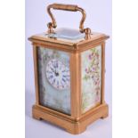 A CONTINENTAL MINIATURE CARRIAGE CLOCK. 6 cm high inc handle.