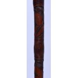 A GOOD JAPANESE MEIJI PERIOD BAMBOO WALKING CANE, carved with four geisha girls in panels, each depi
