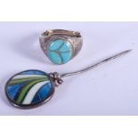 A VINTAGE SILVER AND ENAMEL PIN together with a ring. (2)