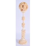 A LARGE 19TH CENTURY CHINESE CARVED IVORY PUZZLE BALL ON STAND Qing. 38 cm high. (2)