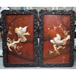 A LARGE PAIR OF 19TH CENTURY JAPANESE MEIJI PERIOD SHIBAYAMA PANELS depicting birds amongst foliage.