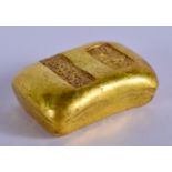 A CHINESE YELLOW METAL INGOT. 78 grams. 2 cm x 3.5 cm.