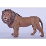 A COLD PAINTED BRONZE FIGURE OF A LION. 9.5 cm wide.