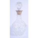 A SILVER MOUNTED GLASS DECANTER. 28 cm high.
