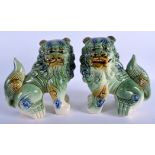 A LARGE PAIR OF CHINESE GREEN GLAZED PORCELAIN FOO DOG STATUE, formed standing. 22.5 cm x 21 cm.