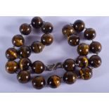 A TIGERS EYE NECKLACE. 48 cm long.