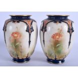 A PAIR OF HADLEY'S WORCESTER PORCELAIN VASES, decorated with foliage. 15.5 cm high