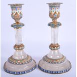 A PAIR OF CONTINENTAL SILVER GILT AND ROCK CRYSTAL CANDLESTICKS. 19 cm high.