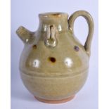 A CHINESE CELADON POTTERY EWER. 14 cm x 10 cm.