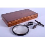 A RAILWAY KEY and a magnifying glass in a box. (3)