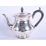 A LOVELY ART DECO HAMMERED SILVER TEAPOT by Sybil Dunlop. London 1930. 17.5 oz. 21 cm wide.