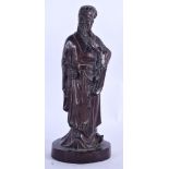 A CHINESE CARVED WOODEN FIGURE OF A STANDING IMMORTAL. 27 cm high.