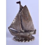 A SMALL VINTAGE SILVER BOAT. 5 cm 3.5 cm.