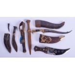 THREE ANTIQUE ISLAMIC MIDDLE EASTERN KNIVES DAGGERS and another. Largest 38 cm long.(4)