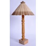 AN EARLY 20TH CENTURY EASTERN CARVED IVORY PARASOL, mounted upon a wooden plinth. 25 cm high.
