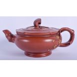 A CHINESE YIXING POTTERY TEAPOT AND COVER. 19 cm wide.