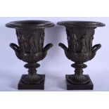 A LARGE PAIR OF BRONZE URNS decorated in relief with figures in various pursuits. 31.5 cm high.