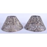 A PAIR OF ANTIQUE CONTINENTAL SILVER SHADES. 2.6 oz. 11 cm wide.