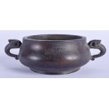 A CHINESE TWIN HANDLED BRONZE CENSER. 13 cm wide.