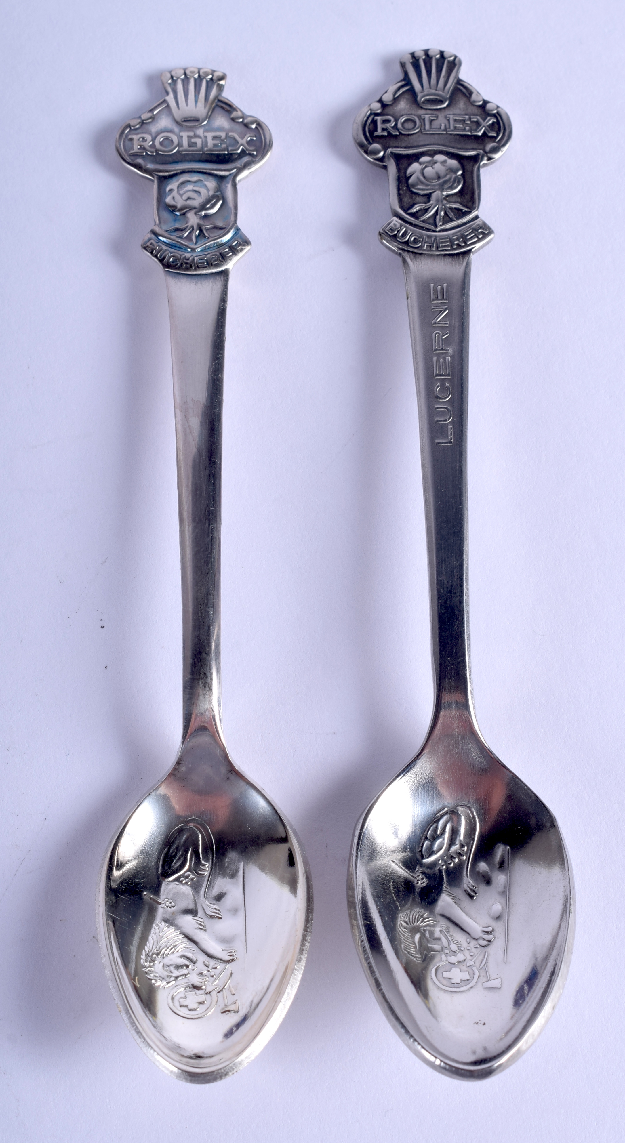 TWO ROLEX SPOONS. (2)