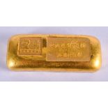 A CHINESE YELLOW METAL INGOT. 175 grams. 6.5 cm wide.