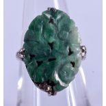 AN ANTIQUE CHINESE WHITE GOLD AND JADE RING. 5.3 grams. M.