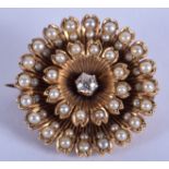 AN ANTIQUE 15CT GOLD AND PEARL DIAMOND BROOCH. 9.2 grams. 2 cm wide.