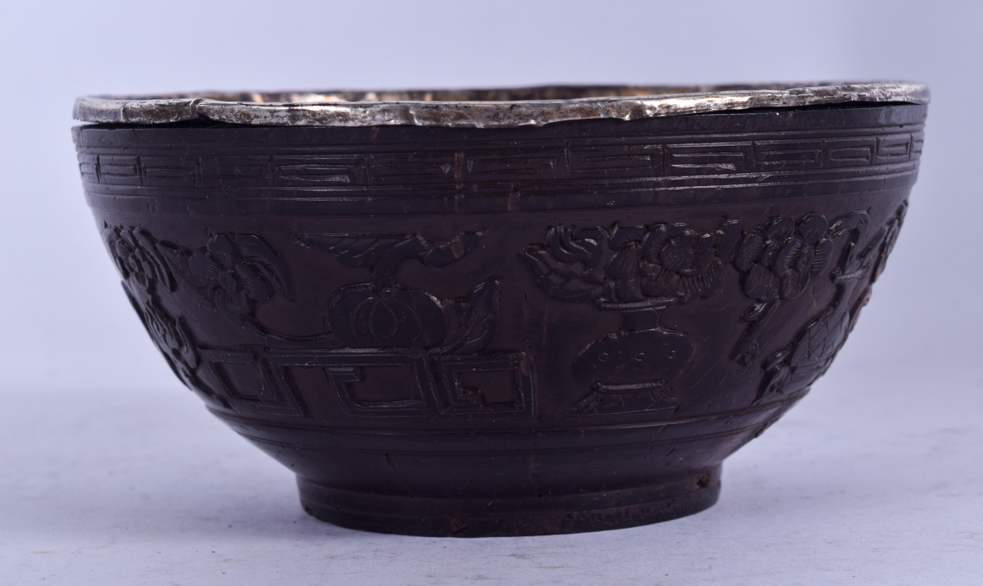 A CHINESE QING DYNASTY COCONUT SHELL BOWL, carved witrh precious objects. 11 cm wide. - Image 2 of 3