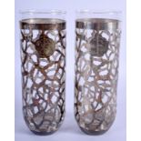 A PAIR OF ART NOUVEAU SILVER AND GLASS VASES. 18 cm high.
