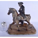 A RARE VICTORIAN CAST IRON FIGURE OF A MILITARY GENTLEMAN modelled upon a horse. Figure 34 cm x 31 c