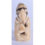 A 19TH CENTURY JAPANESE MEIJI PERIOD CARVED IVORY GEISHA. 6 cm x 2 cm.