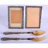 A PAIR OF VINTAGE SILVER MIRRORS together with a pair of horn serving knives. (4)