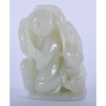 A CHINESE CARVED GREEN JADE FIGURE, formed as a young boy. 6.5 cm x 4.25 cm.