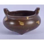 A CHINESE GOLD SPLASH BRONZE CENSER. 6 cm wide.