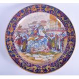 A VERY LARGE 19TH CENTURY CONTINENTAL FAIENCE MAJOLICA CHARGER painted with classical scenes. 50 cm