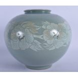 A PALE GREEN GLAZED KOREAN PORCELAIN VASE, decorated with bold foliage. 20 cm x 22 cm.